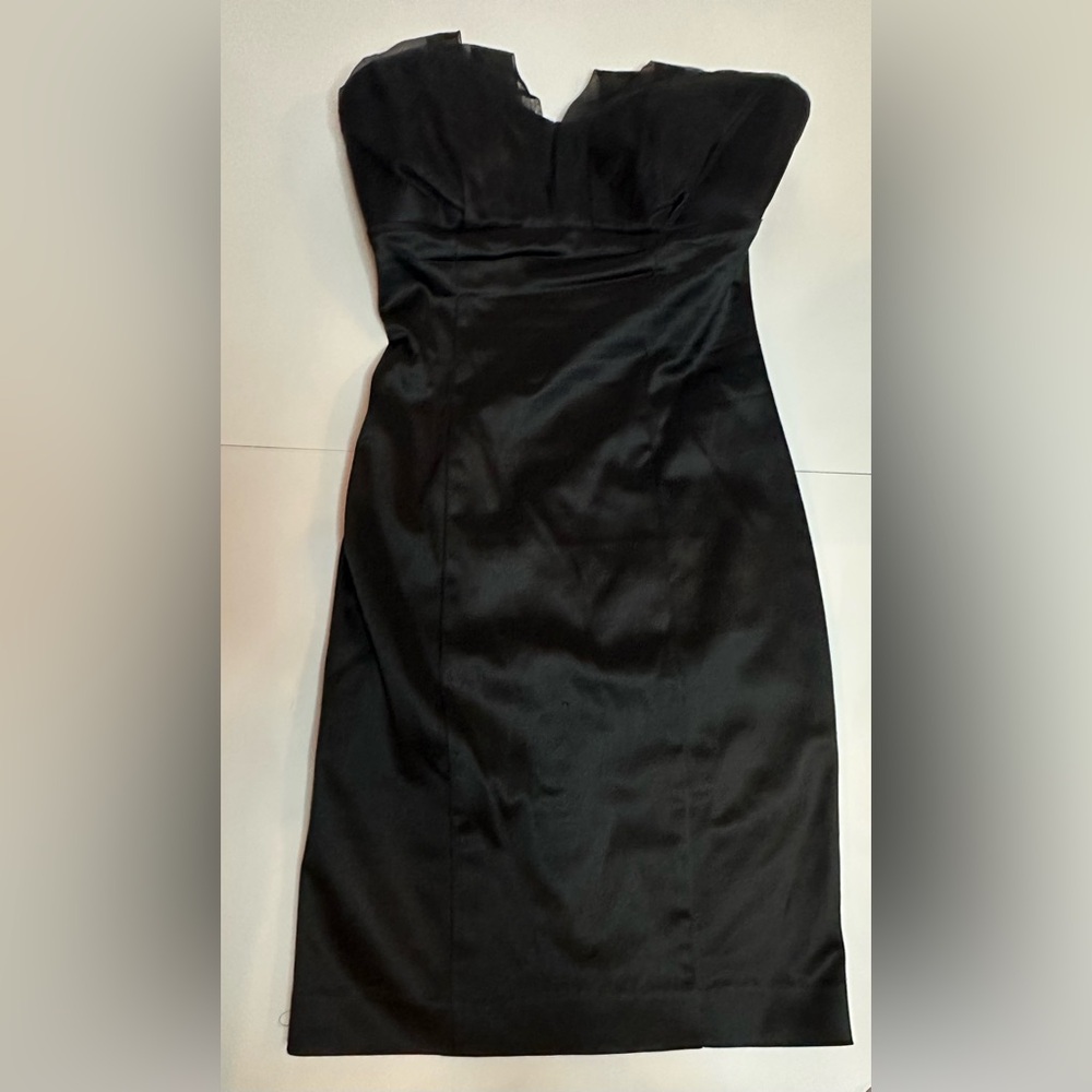 Bebe black mini dress; strapless: zipper in back.